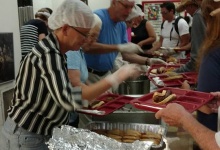 Sacred Journeys serving food at St. Luke's Episcopal Hot Meal Program.